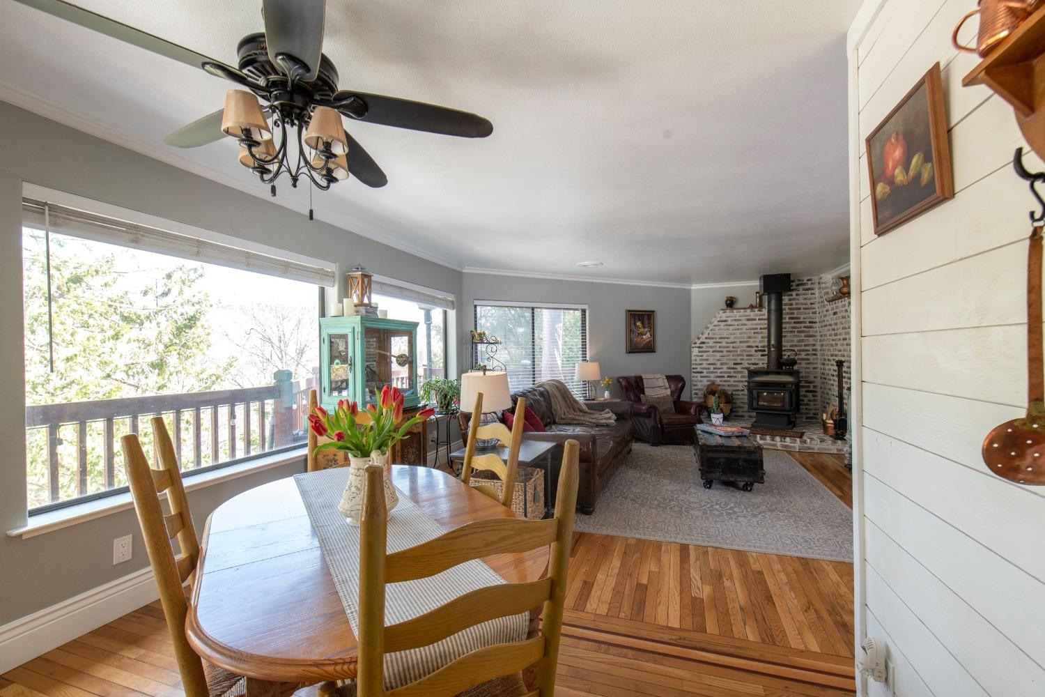 33952 Tocaloma Road Auberry, CA 93602 - Photo 11 of 48 a view of a dining room with furniture window and wooden floor