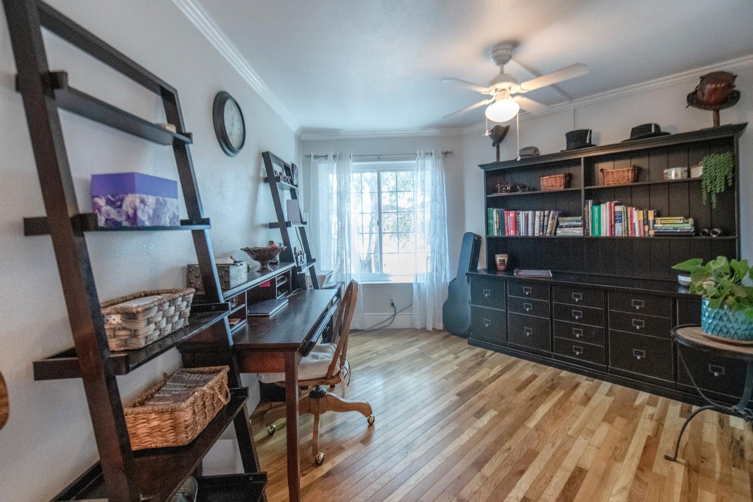 33952 Tocaloma Road Auberry, CA 93602 - Photo 22 of 48 a room with furniture and wooden floor