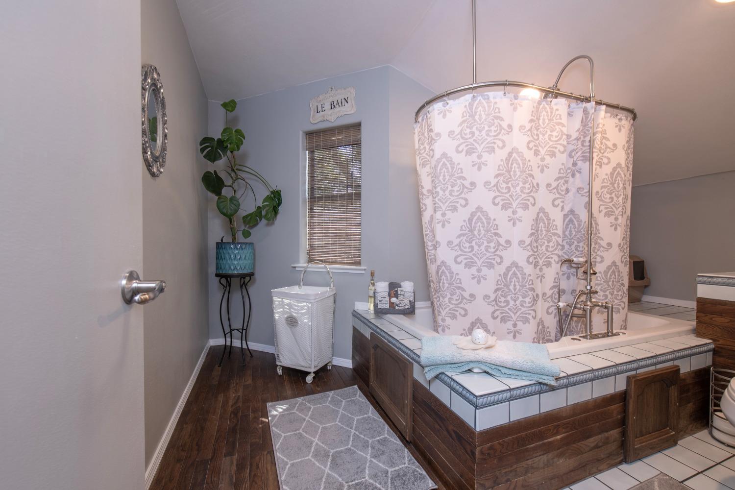 33952 Tocaloma Road Auberry, CA 93602 - Photo 29 of 48 a bathroom with a sink a toilet and a mirror
