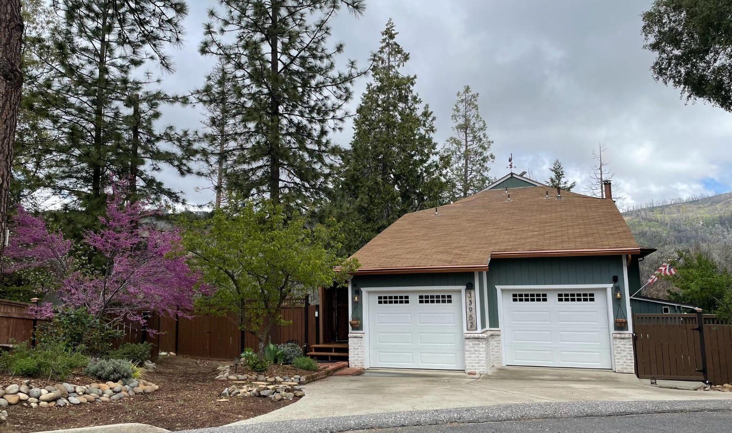 33952 Tocaloma Road Auberry, CA 93602 - Photo 42 of 48 a front view of a house with a garden