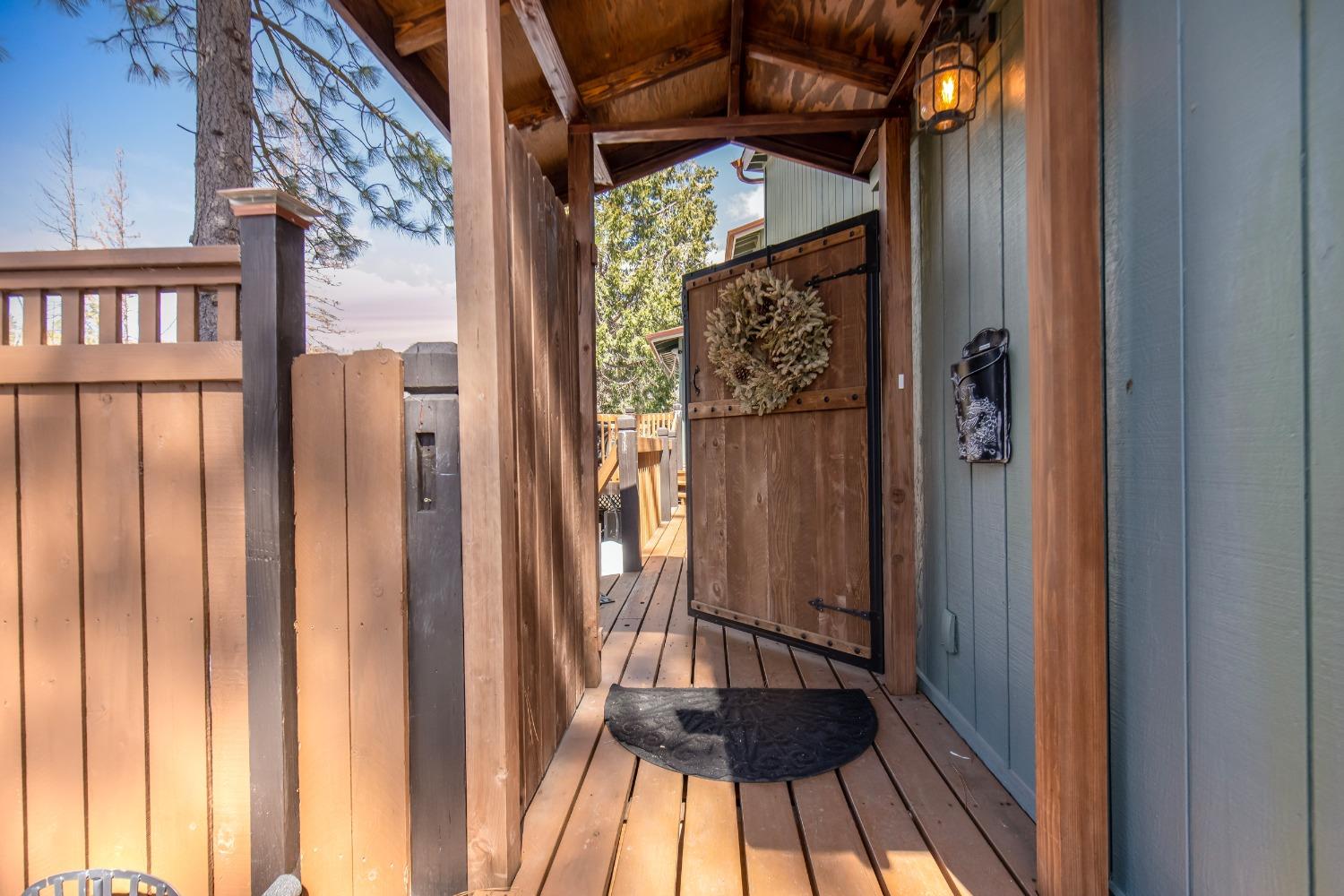 33952 Tocaloma Road Auberry, CA 93602 - Photo 5 of 48 a view of a balcony with wooden floor
