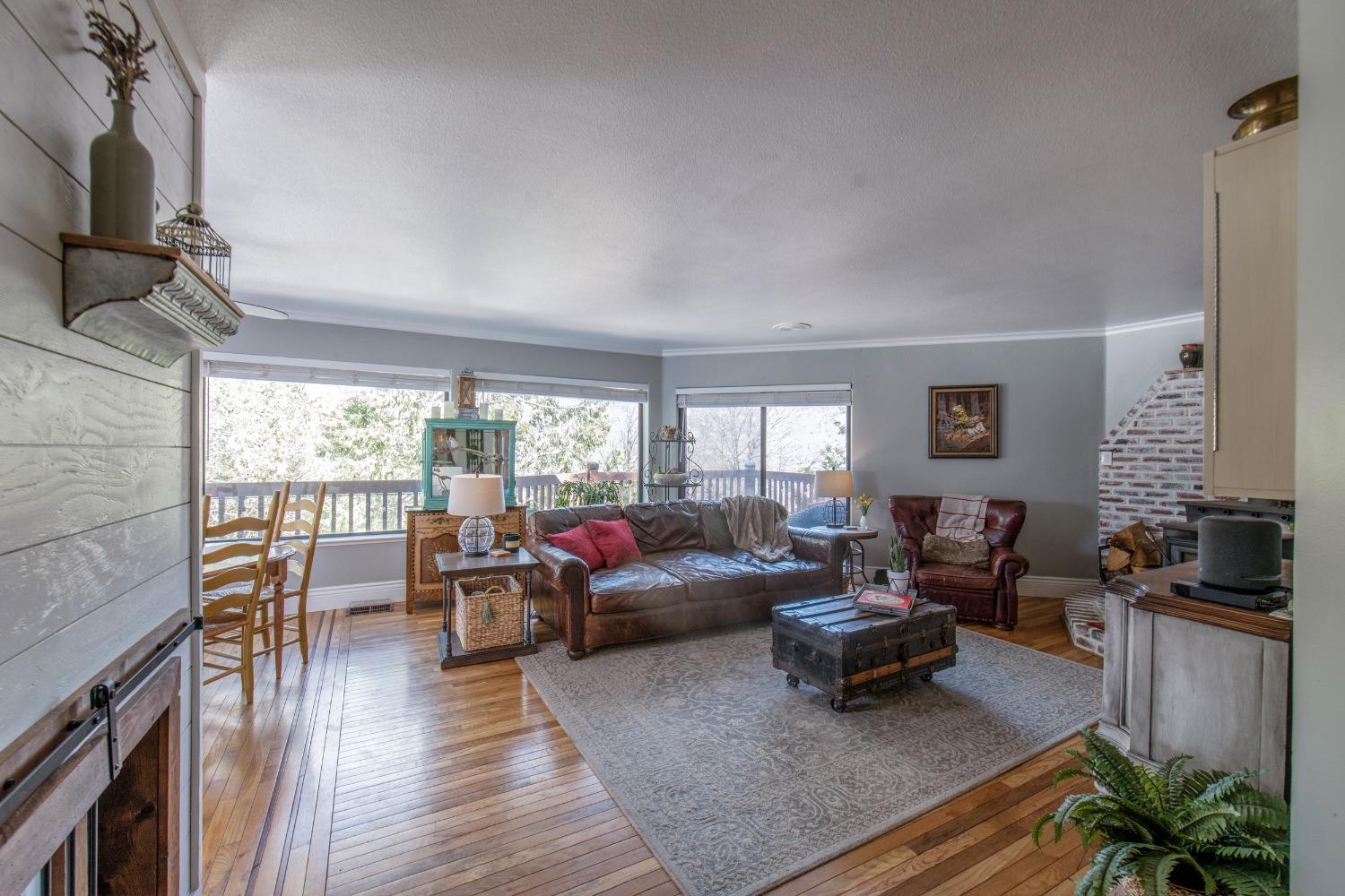 33952 Tocaloma Road Auberry, CA 93602 - Photo 7 of 48 a living room with furniture and a large window