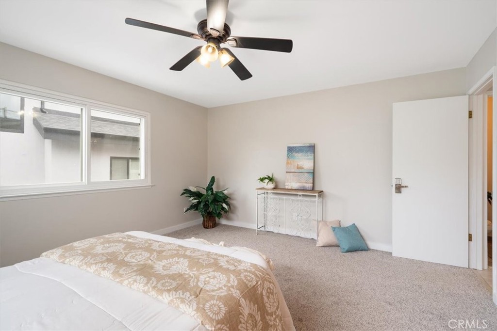 96 24th Street Cayucos, CA 93430 - Photo 17 of 49 a bedroom with a bed and a potted plant