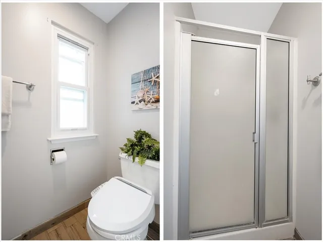 a white toilet sitting next to a bathroom sink