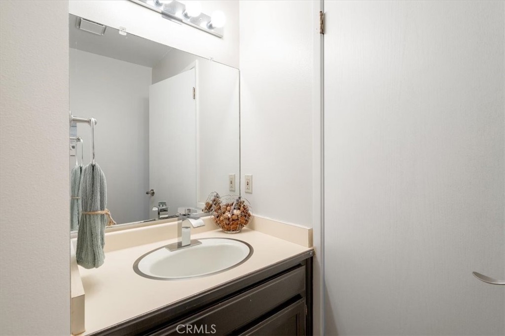 96 24th Street Cayucos, CA 93430 - Photo 28 of 49 a bathroom with a sink and a mirror
