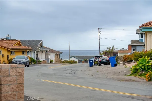 a view of a street with cars