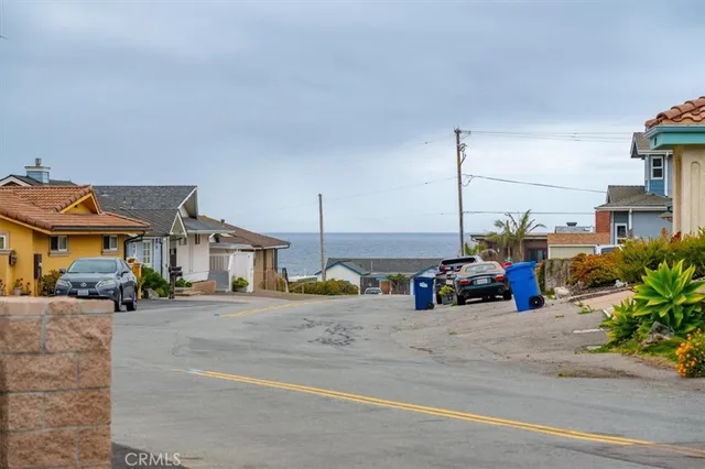 a view of a street with cars