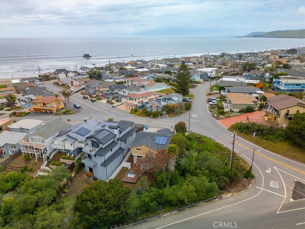 96 24th Street Cayucos, CA 93430 - Photo 42 of 49 an aerial view of a city with lots of residential buildings ocean and mountain view in back