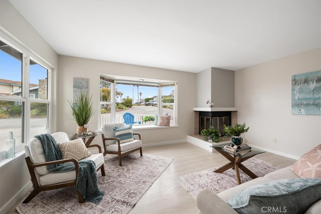 96 24th Street Cayucos, CA 93430 - Photo 8 of 49 a living room with furniture and a large window