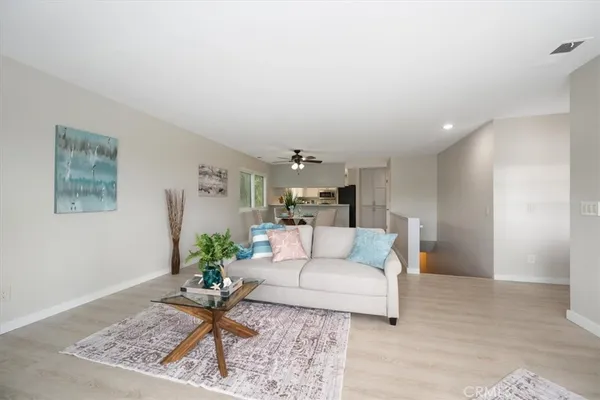 a living room with furniture and a rug