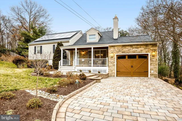 a kitchen with a stove a refrigerator a sink dishwasher with a dining table and chairs with wooden floor