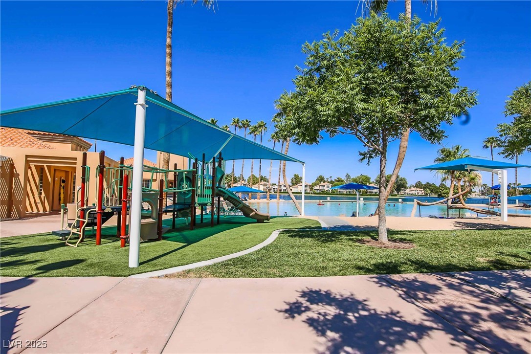 3151 North Soaring Gulls Drive, Unit 1188 Las Vegas, NV 89128 - Photo 43 of 43 Community playground featuring a yard and a water view