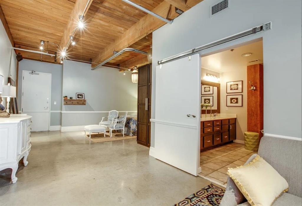 509 Elm Street, Unit 305 Dallas, TX 75202 - Photo 1 of 1 a living room with furniture