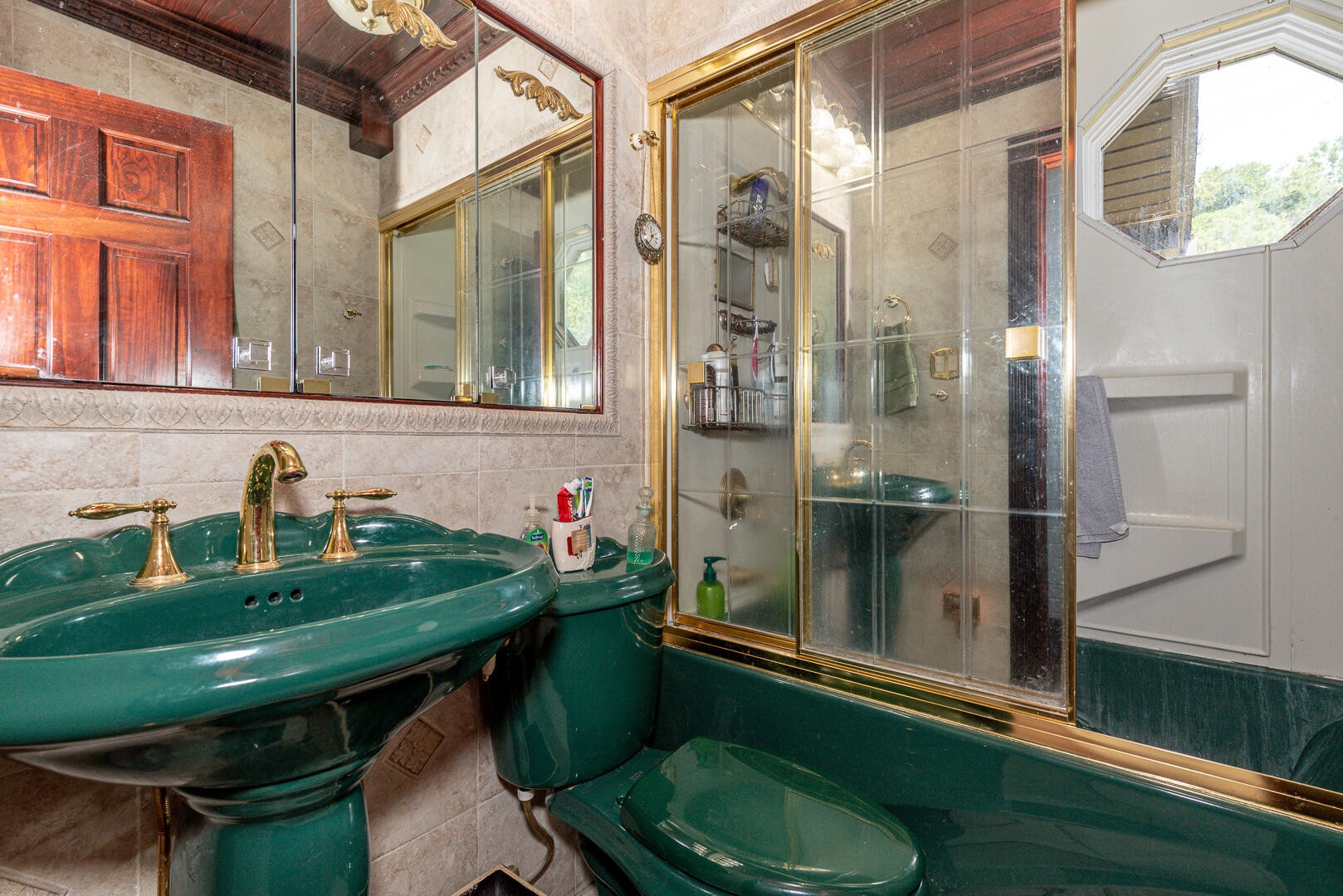511 Delaware Avenue Oak Ridge, TN 37830 - Photo 13 of 37 a bathroom with a sink a toilet and a mirror