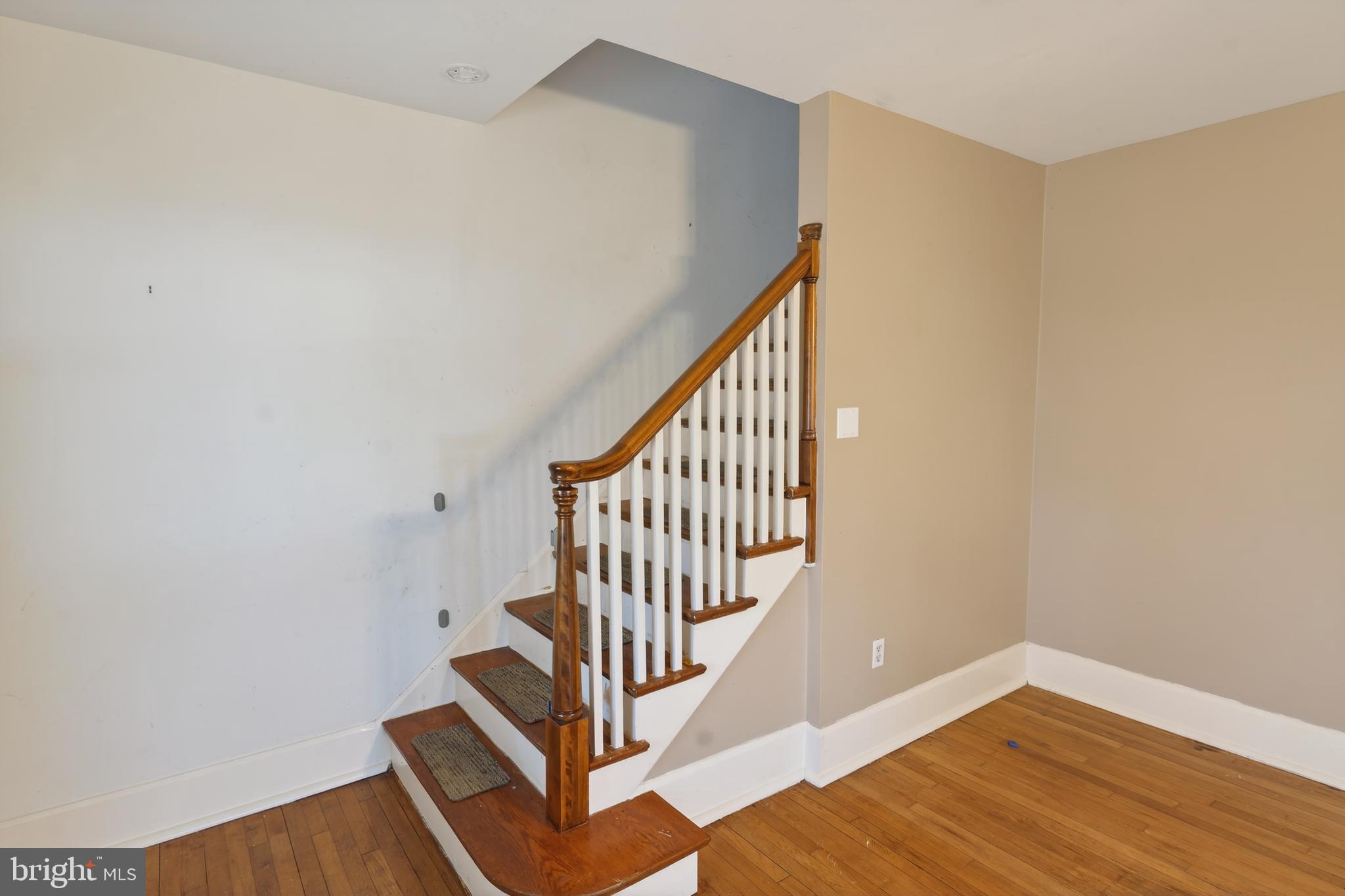 3202 Old Ocean City Road Salisbury, MD 21804 - Photo 15 of 29 a view of staircase with wooden floor and white walls