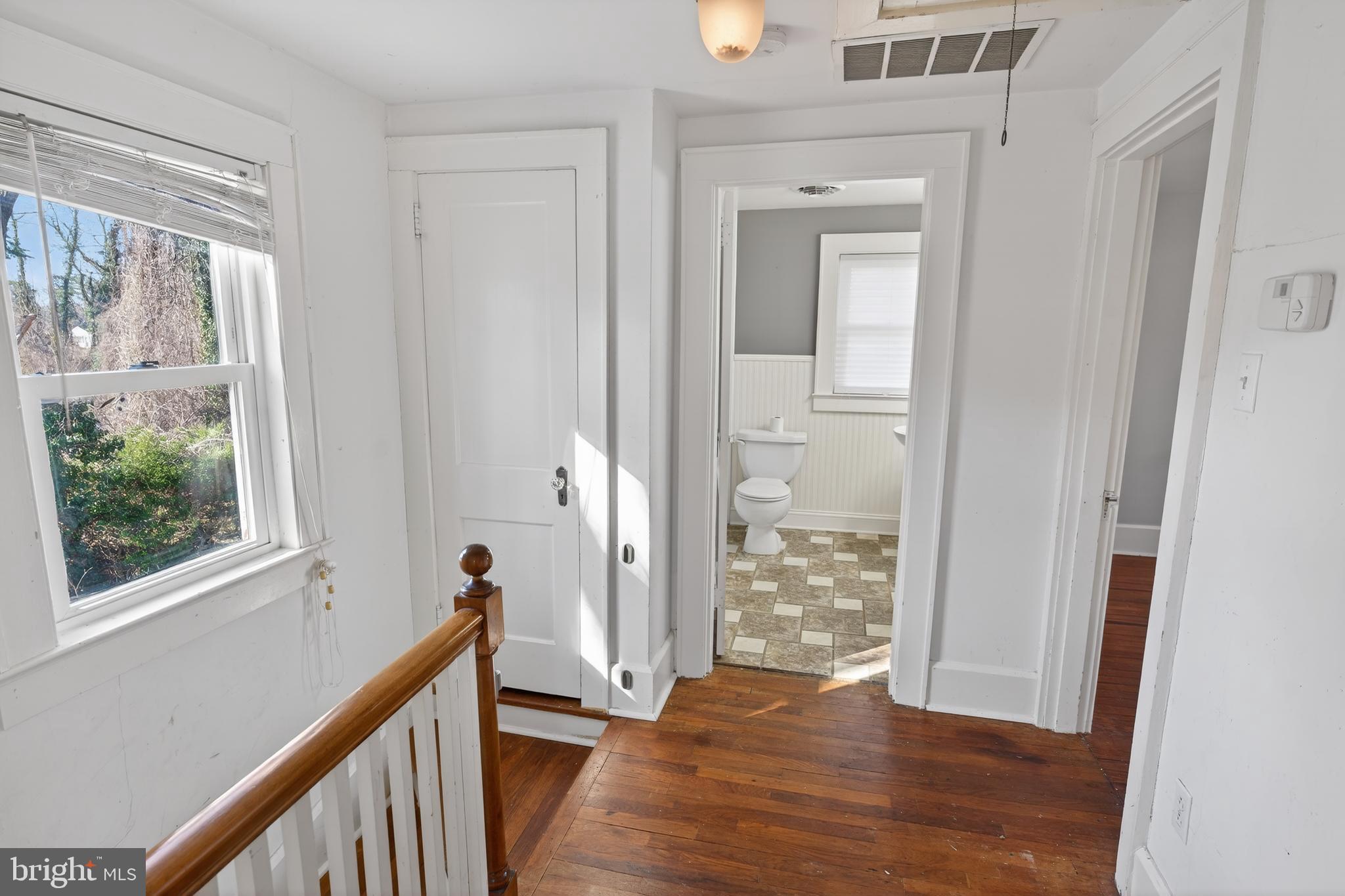 3202 Old Ocean City Road Salisbury, MD 21804 - Photo 16 of 29 a view of a hallway with wooden floor and stairs