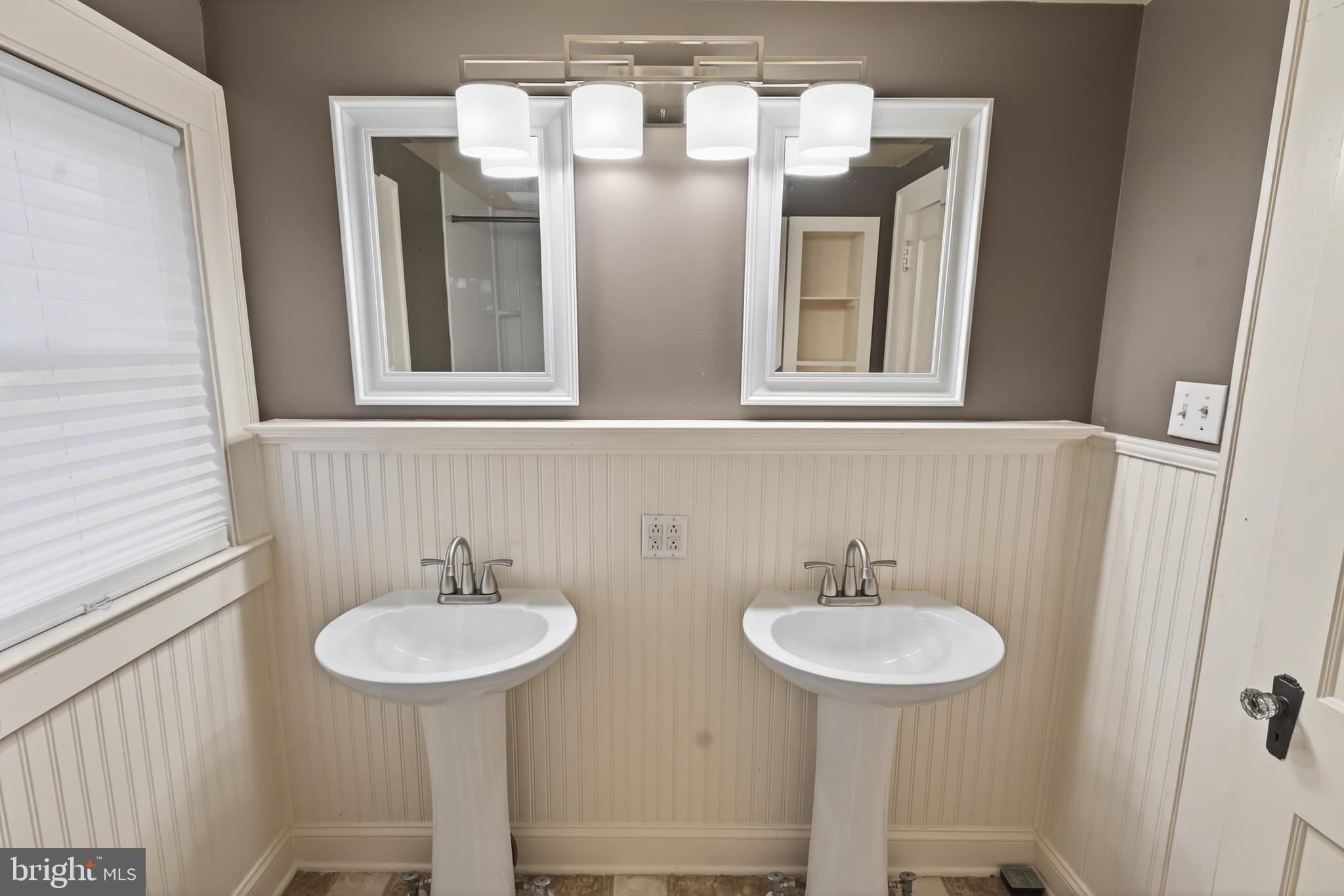 3202 Old Ocean City Road Salisbury, MD 21804 - Photo 17 of 29 a bathroom with a sink and a mirror