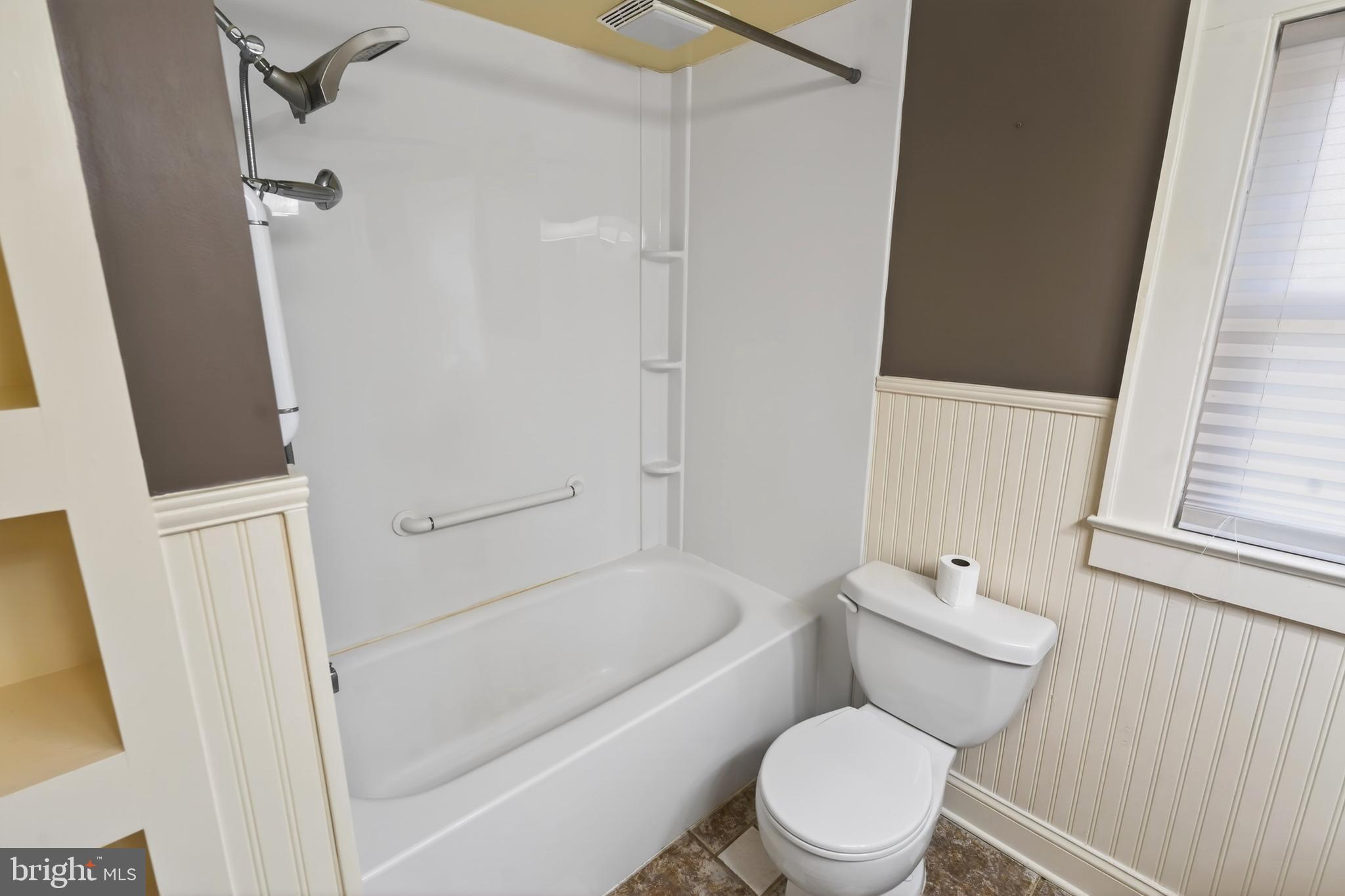 3202 Old Ocean City Road Salisbury, MD 21804 - Photo 19 of 29 a white toilet sitting next to a bath tub