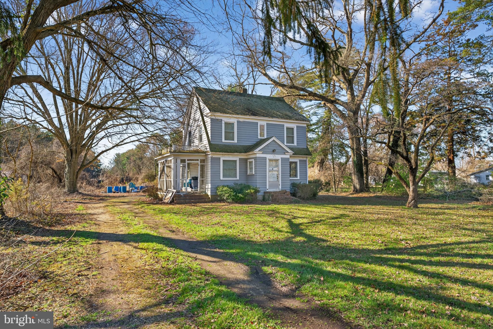 3202 Old Ocean City Road Salisbury, MD 21804 - Photo 2 of 29 a front view of a house with a yard table and chairs