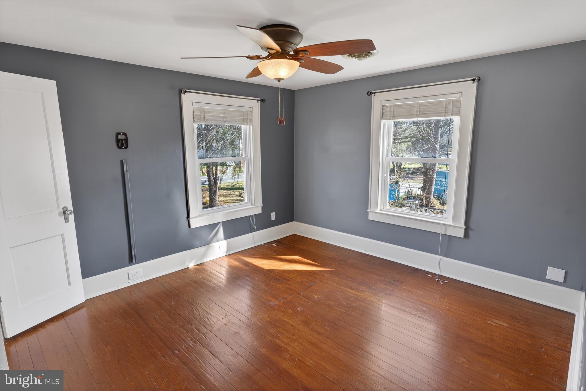 3202 Old Ocean City Road Salisbury, MD 21804 - Photo 21 of 29 a view of an empty room with a window and wooden floor
