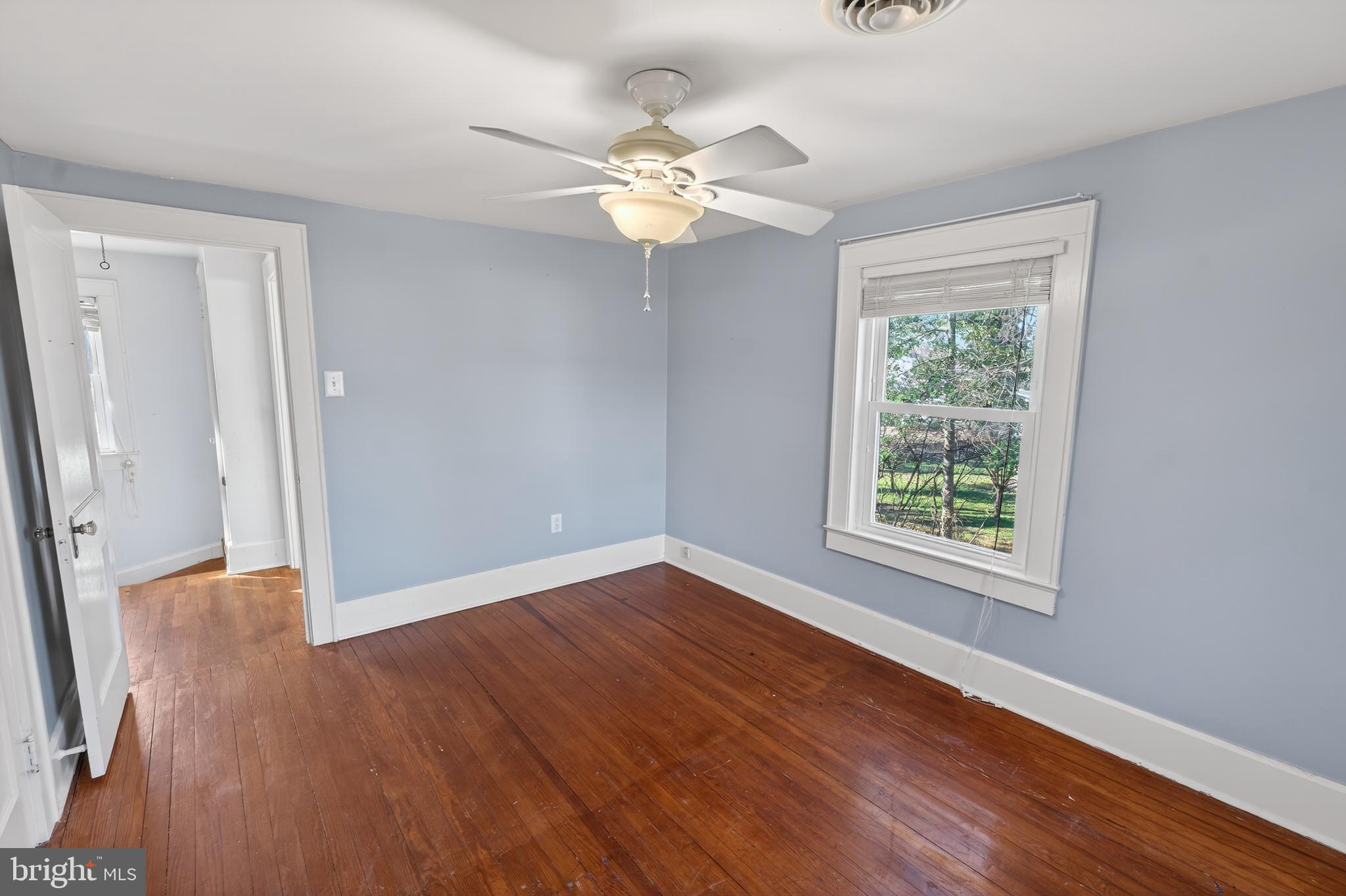 3202 Old Ocean City Road Salisbury, MD 21804 - Photo 23 of 29 wooden floor in an empty room with a window