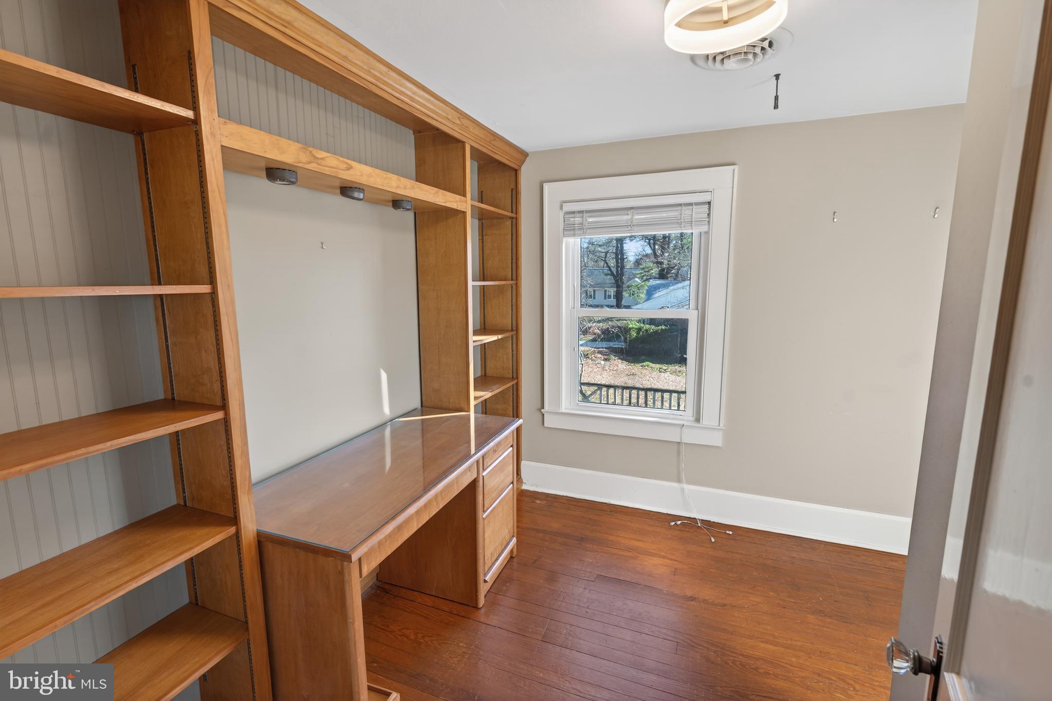 3202 Old Ocean City Road Salisbury, MD 21804 - Photo 26 of 29 a view of an empty room with wooden floor and a window