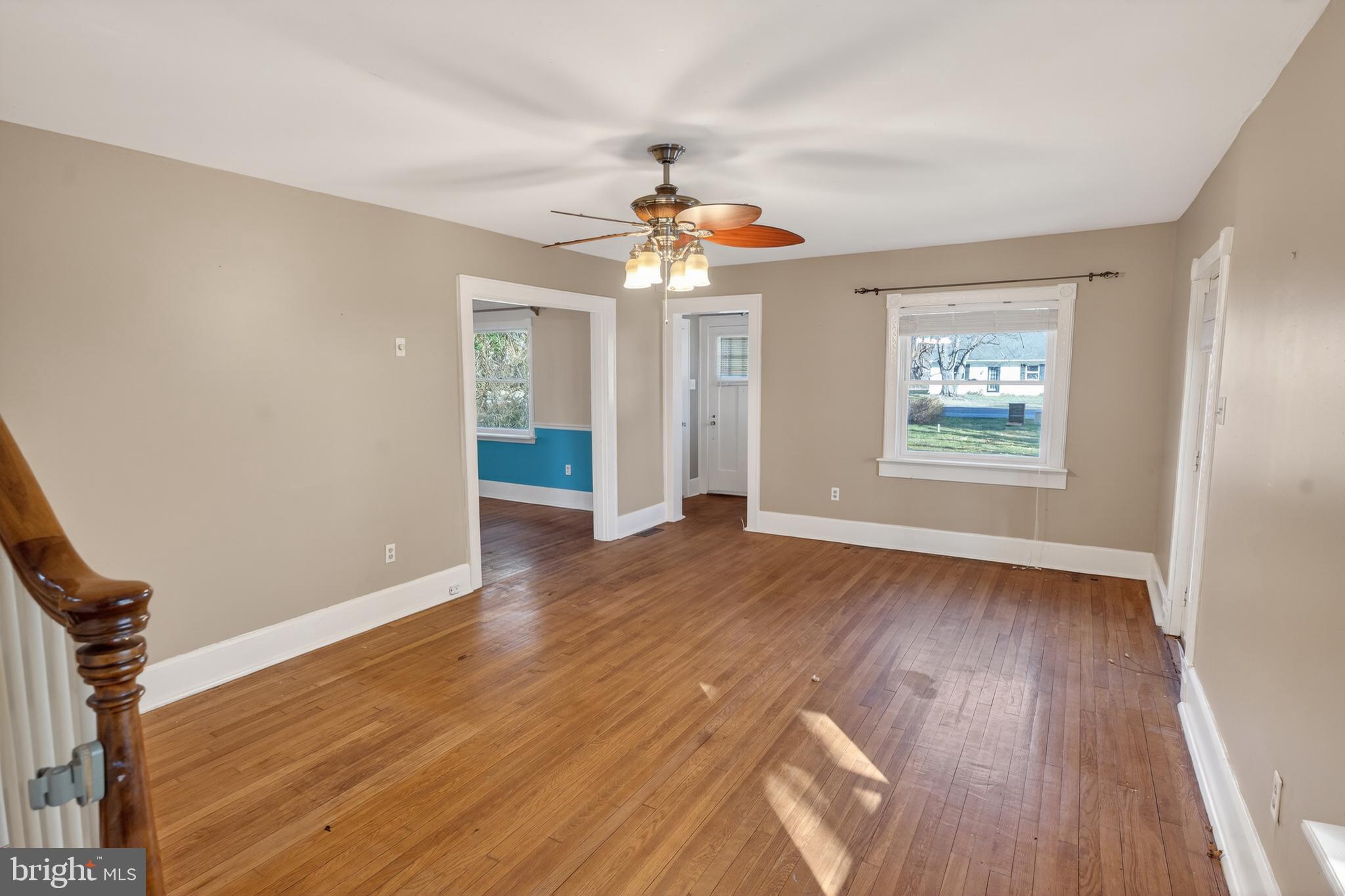 3202 Old Ocean City Road Salisbury, MD 21804 - Photo 3 of 29 wooden floor in an empty room with a window
