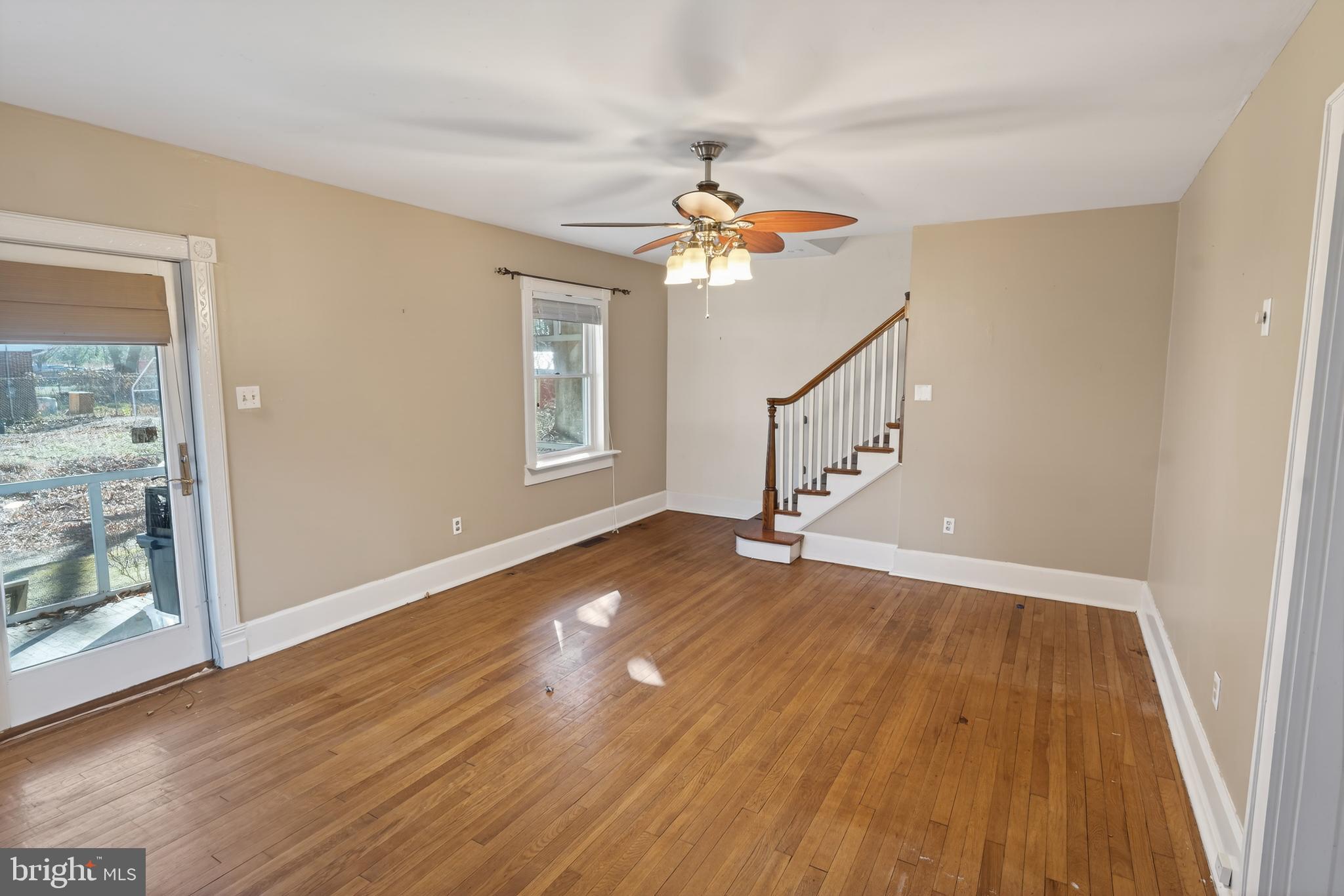 3202 Old Ocean City Road Salisbury, MD 21804 - Photo 5 of 29 wooden floor in an empty room with a window