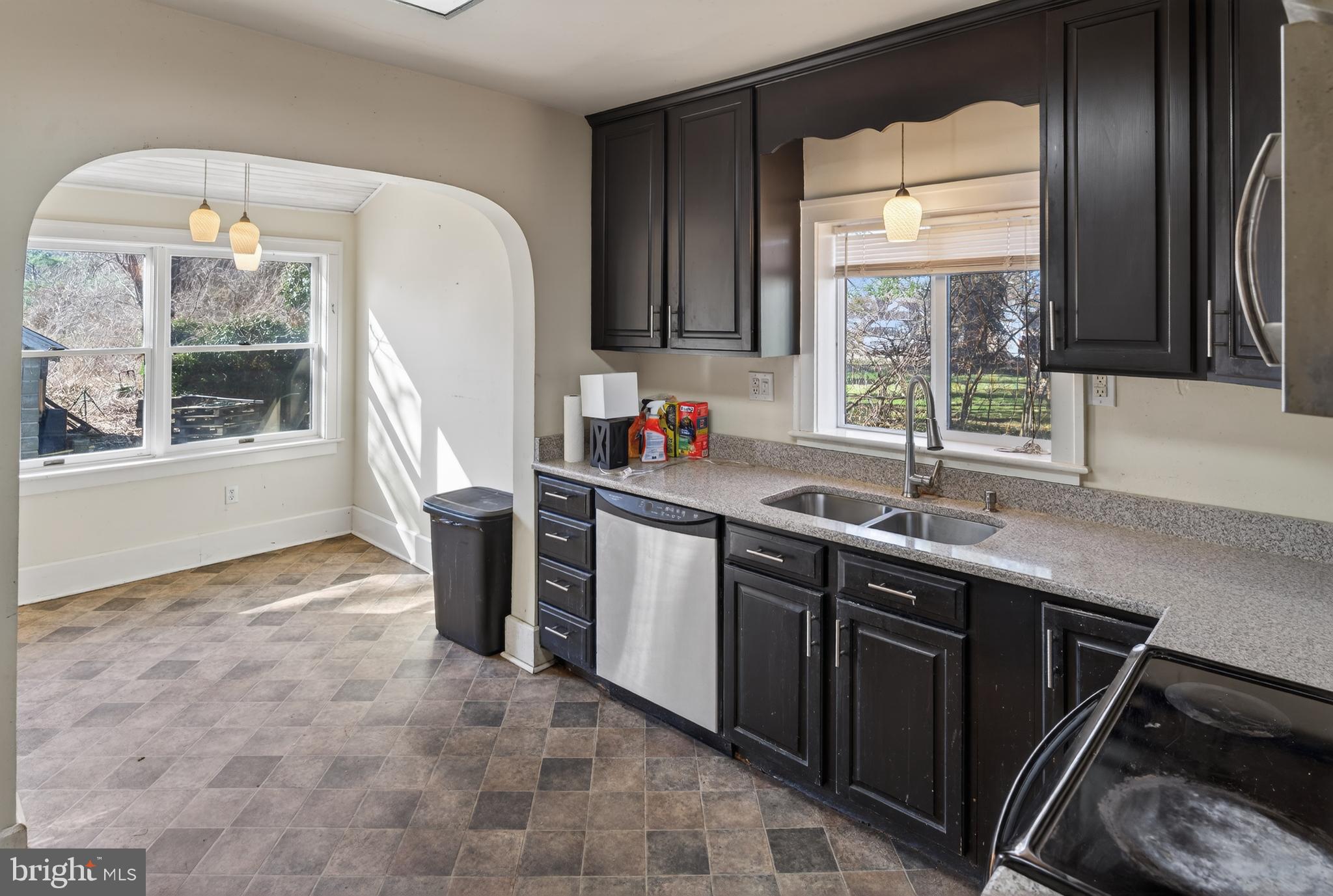 3202 Old Ocean City Road Salisbury, MD 21804 - Photo 8 of 29 a kitchen with stainless steel appliances a sink stove and window