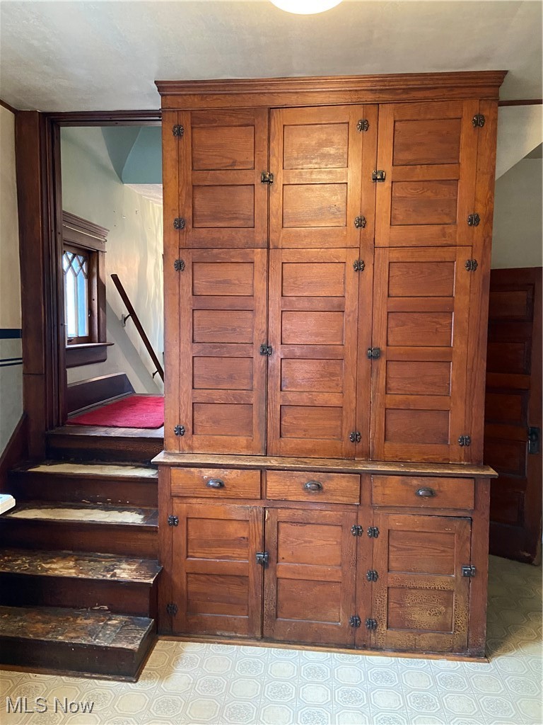 752 Chalker Street Akron, OH 44310 - Photo 15 of 34 Floor to ceiling side blt in cabinet - BSMT stairwell to rt - Bk stairwell to upper flr
