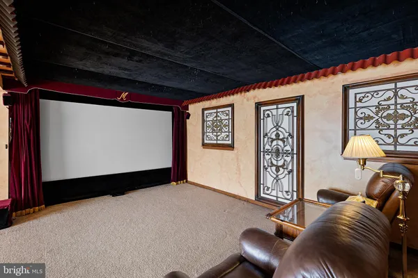 a view of a livingroom with furniture and a flat screen tv