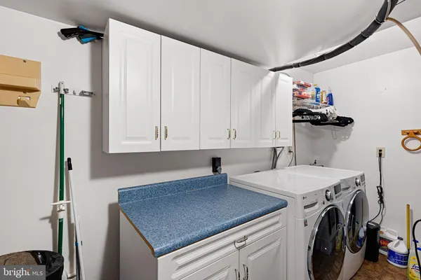 a kitchen with a sink a stove and cabinets