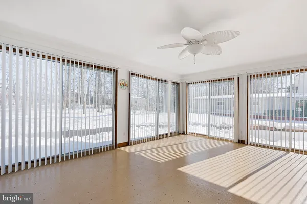 a bedroom with a large bed and a large window