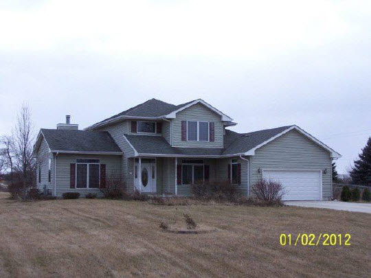 8550 South Rood Road Kingston, IL 60145 - Photo 1 of 9 a front view of a house with a garden
