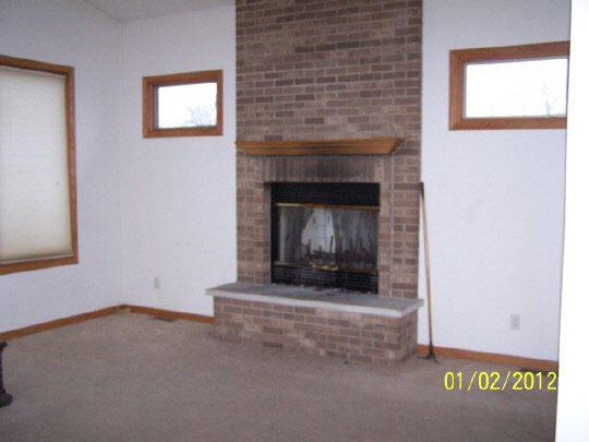 8550 South Rood Road Kingston, IL 60145 - Photo 3 of 9 a room with a fireplace