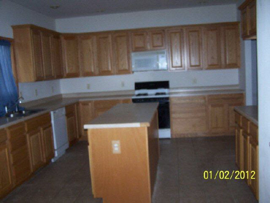 8550 South Rood Road Kingston, IL 60145 - Photo 4 of 9 a kitchen with a sink and cabinets