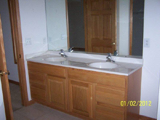 8550 South Rood Road Kingston, IL 60145 - Photo 8 of 9 a bathroom with a sink and a mirror