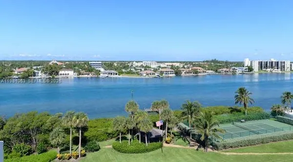 an aerial view of a house with a lake view