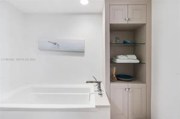 a bathroom with a shower and a sink