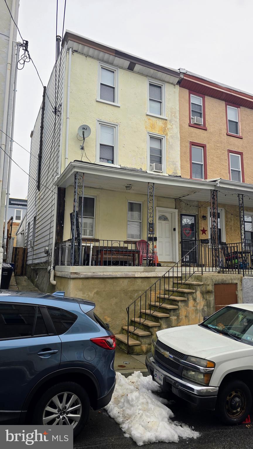 a front view of a house with swimming pool