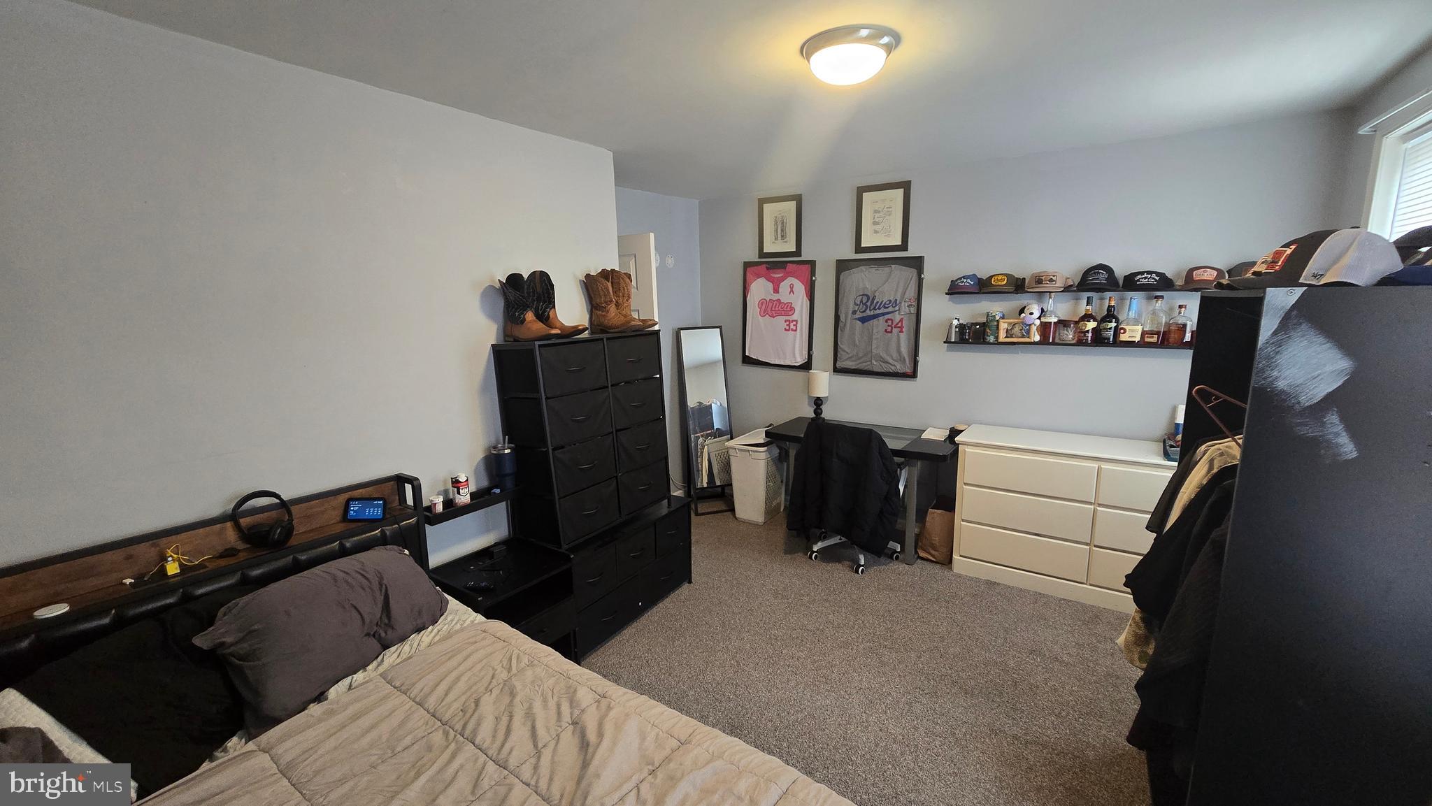 4709 Fowler Street Philadelphia, PA 19127 - Photo 11 of 21 a bedroom with a bed and cabinets