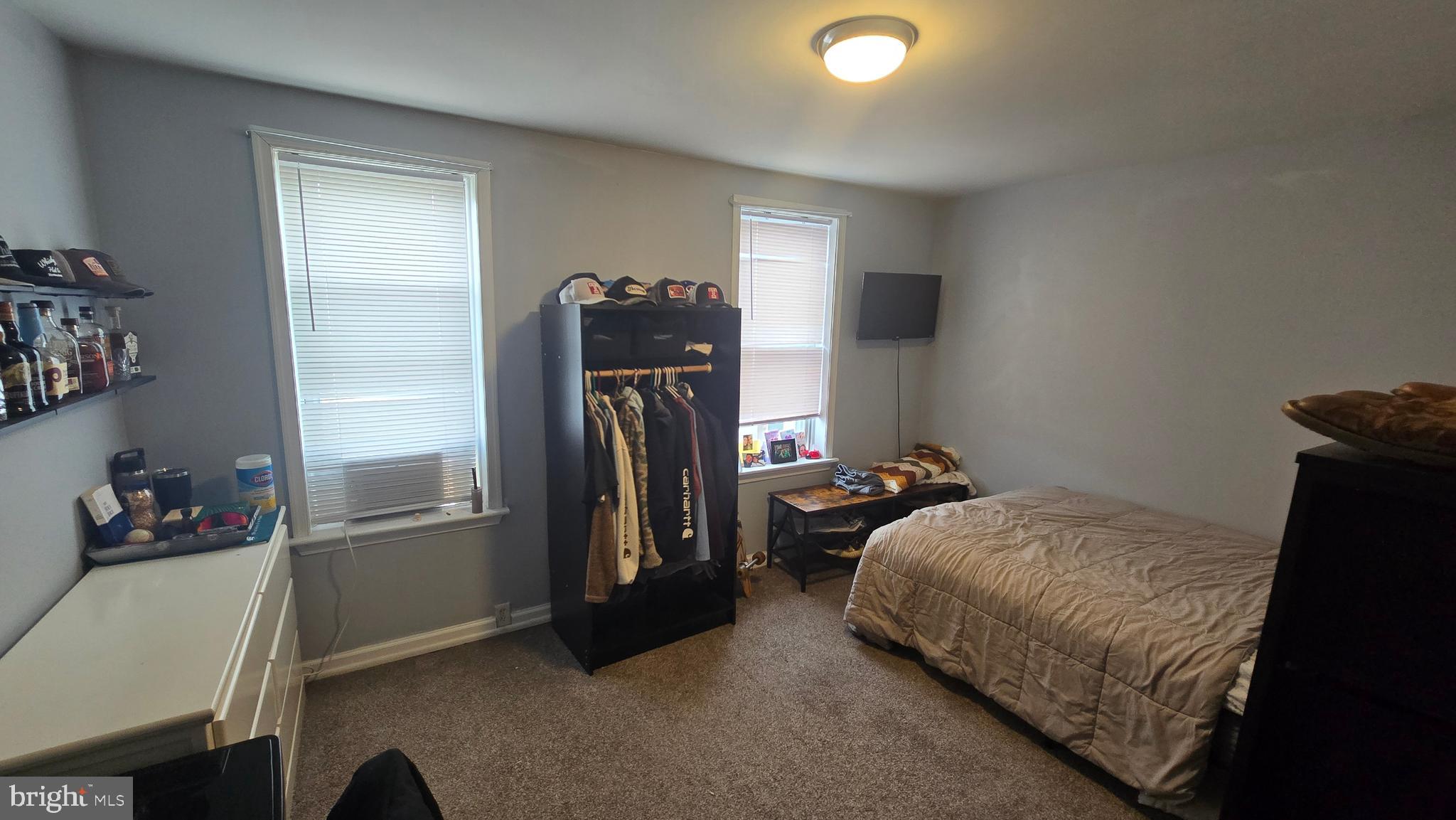 4709 Fowler Street Philadelphia, PA 19127 - Photo 12 of 21 a bedroom with a bed and a refrigerator