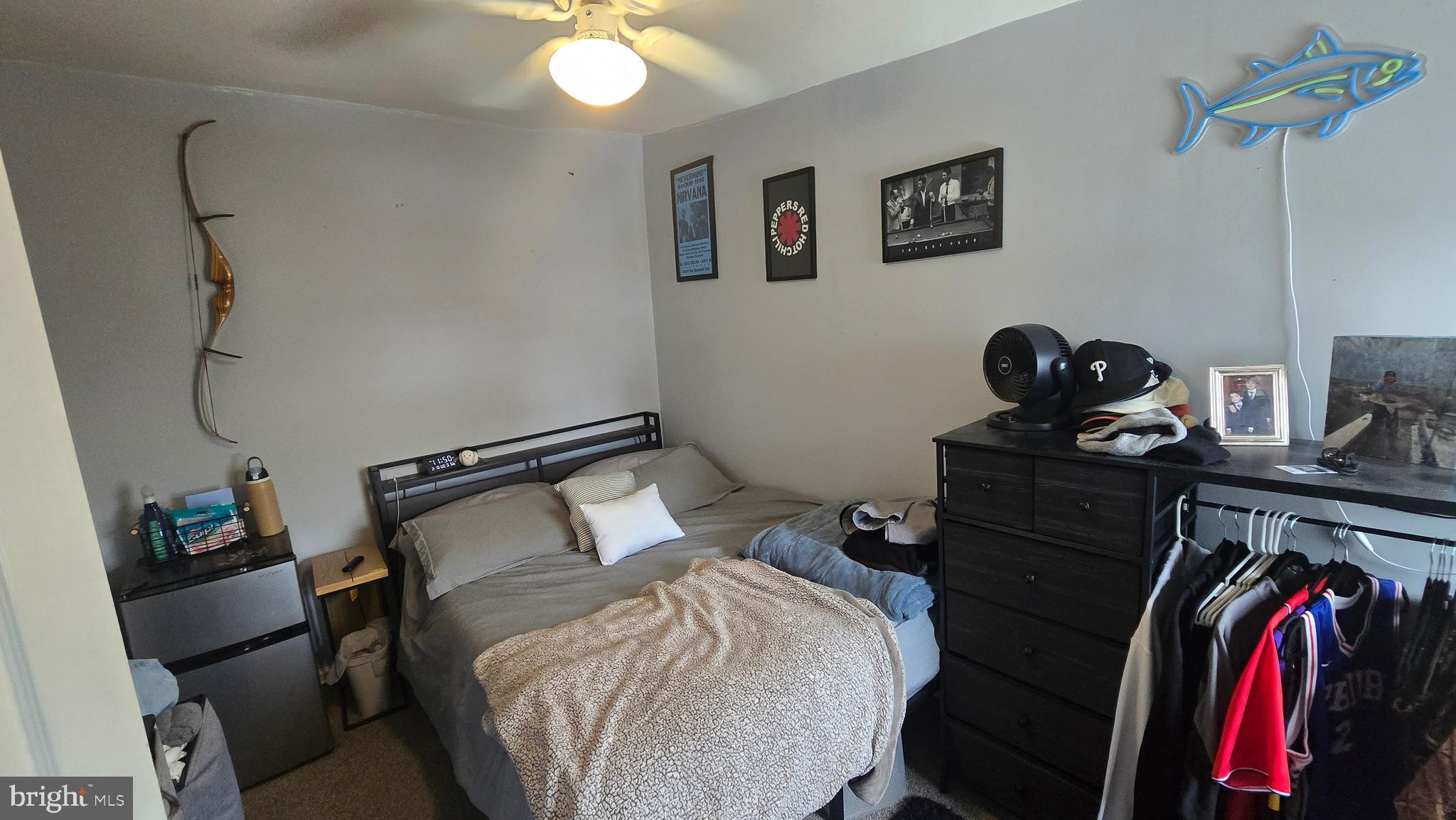4709 Fowler Street Philadelphia, PA 19127 - Photo 13 of 21 a bedroom with a bed and a mirror