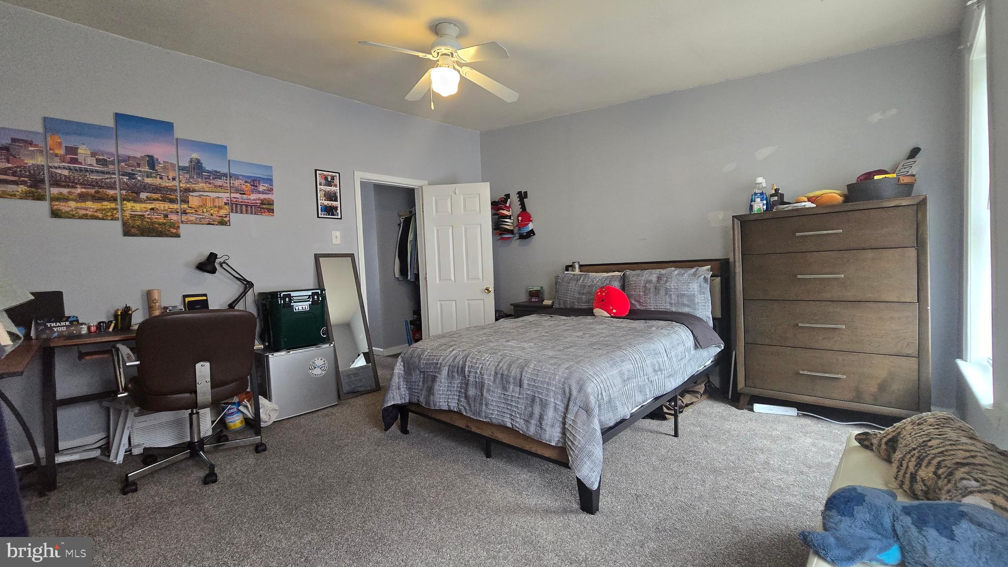 4709 Fowler Street Philadelphia, PA 19127 - Photo 15 of 21 a bedroom with a bed and a chandelier