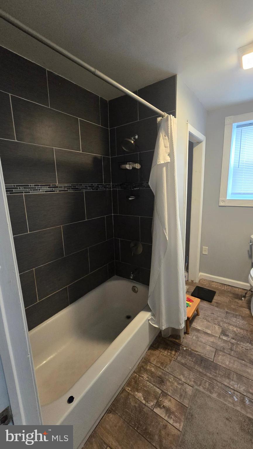 4709 Fowler Street Philadelphia, PA 19127 - Photo 18 of 21 a bathroom with a bathtub and a shower