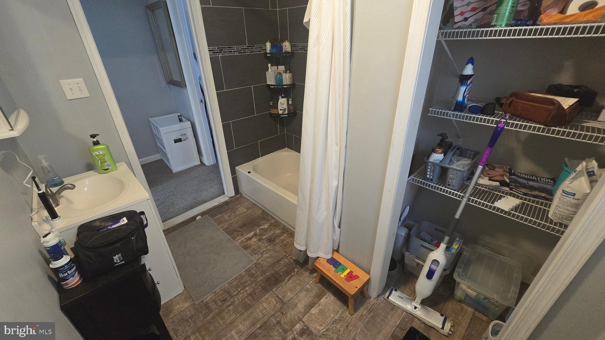 4709 Fowler Street Philadelphia, PA 19127 - Photo 20 of 21 walk in closet with wooden floor washer and dryer