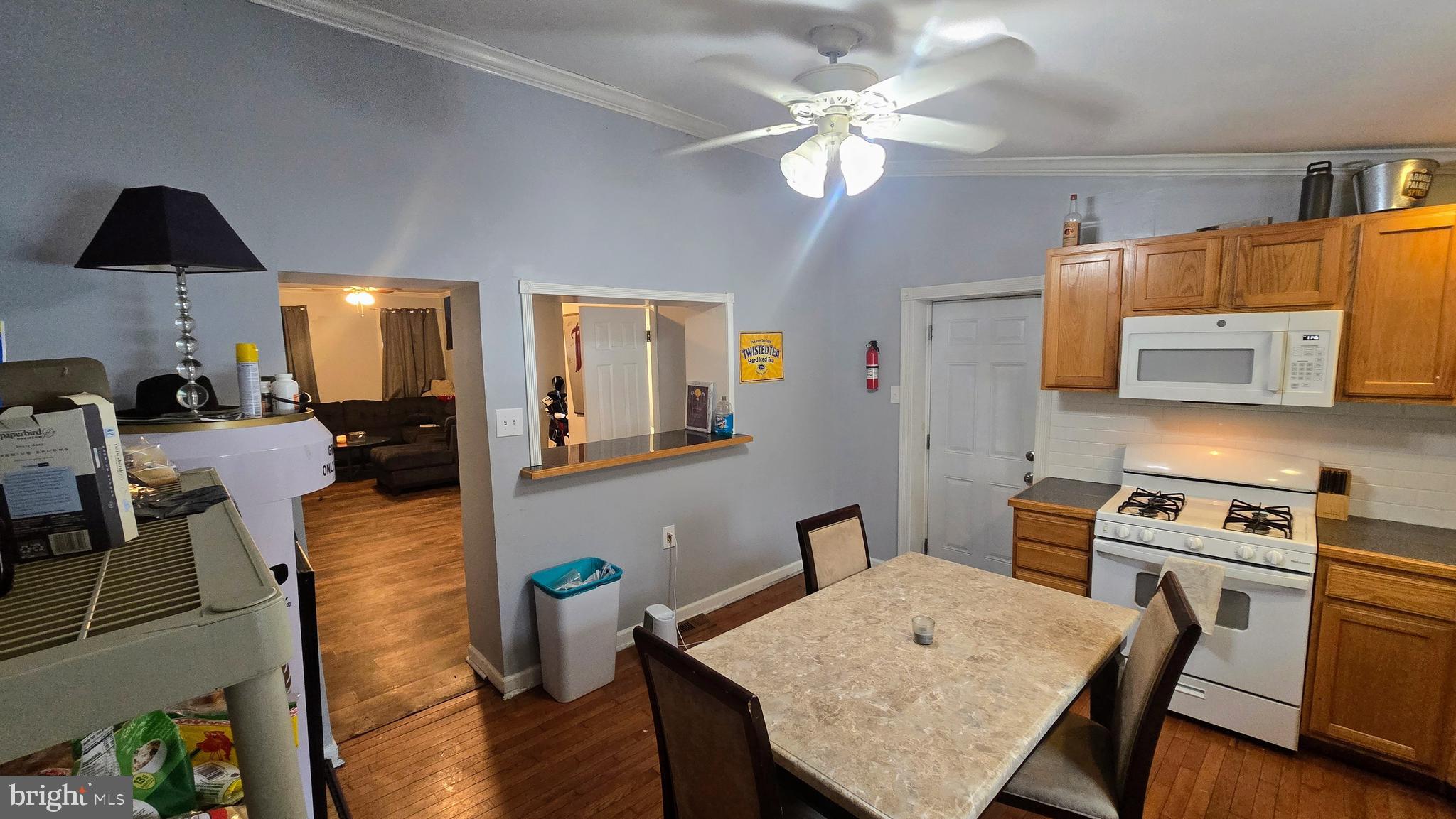 4709 Fowler Street Philadelphia, PA 19127 - Photo 4 of 21 a kitchen with a table chairs and a refrigerator