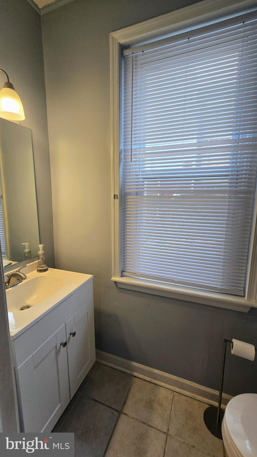 4709 Fowler Street Philadelphia, PA 19127 - Photo 8 of 21 a bathroom with a sink and a mirror