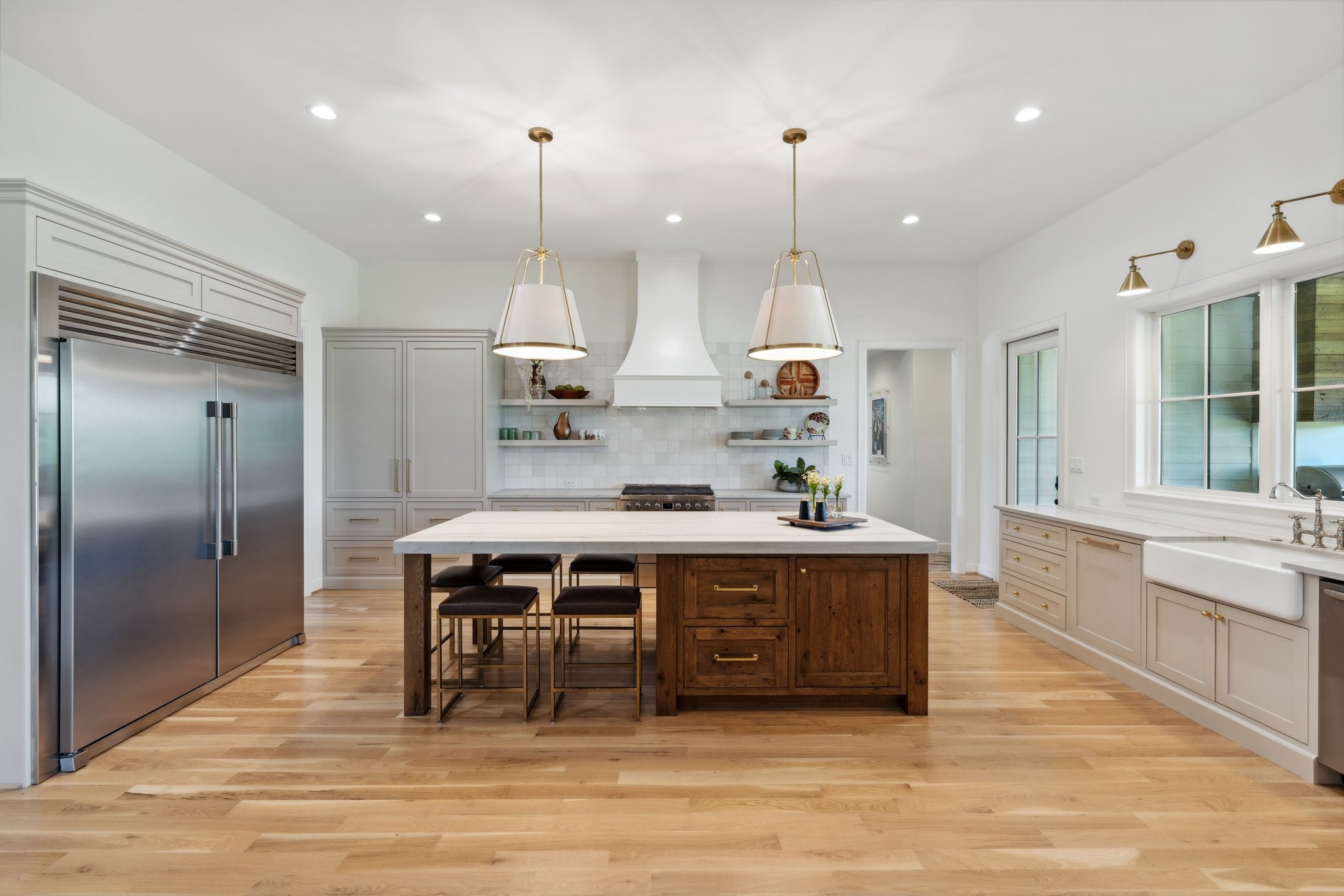4052 Kuykendall Road Bellville, TX 77418 - Photo 6 of 40 This sleek, modern kitchen boasts top-end appliances and a spacious pantry, perfect for culinary enthusiasts.