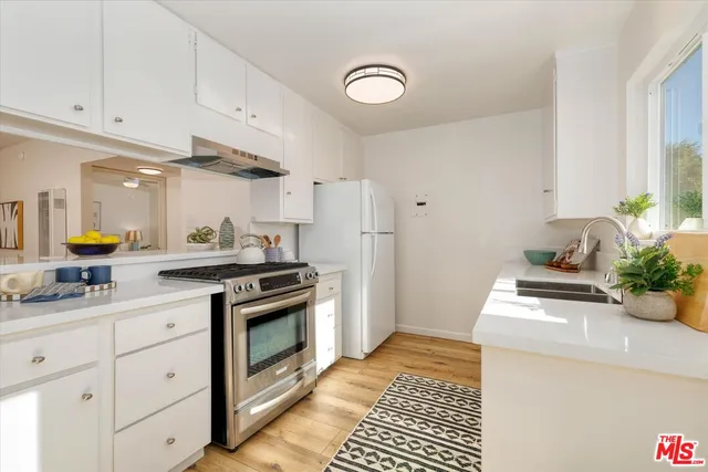 a kitchen with a stove and a sink